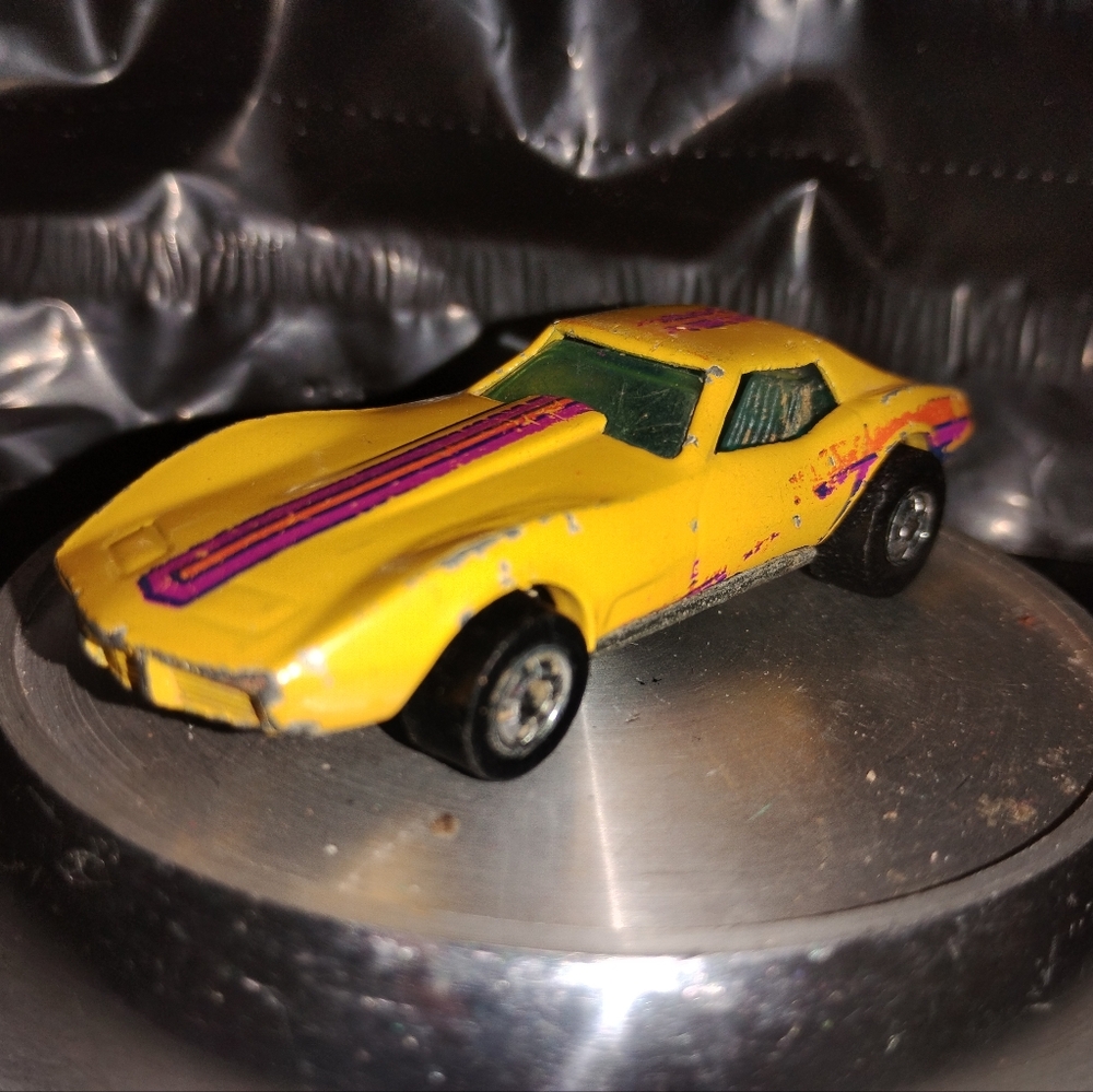 Vintage Yellow Hot Wheels with Purple Stripes